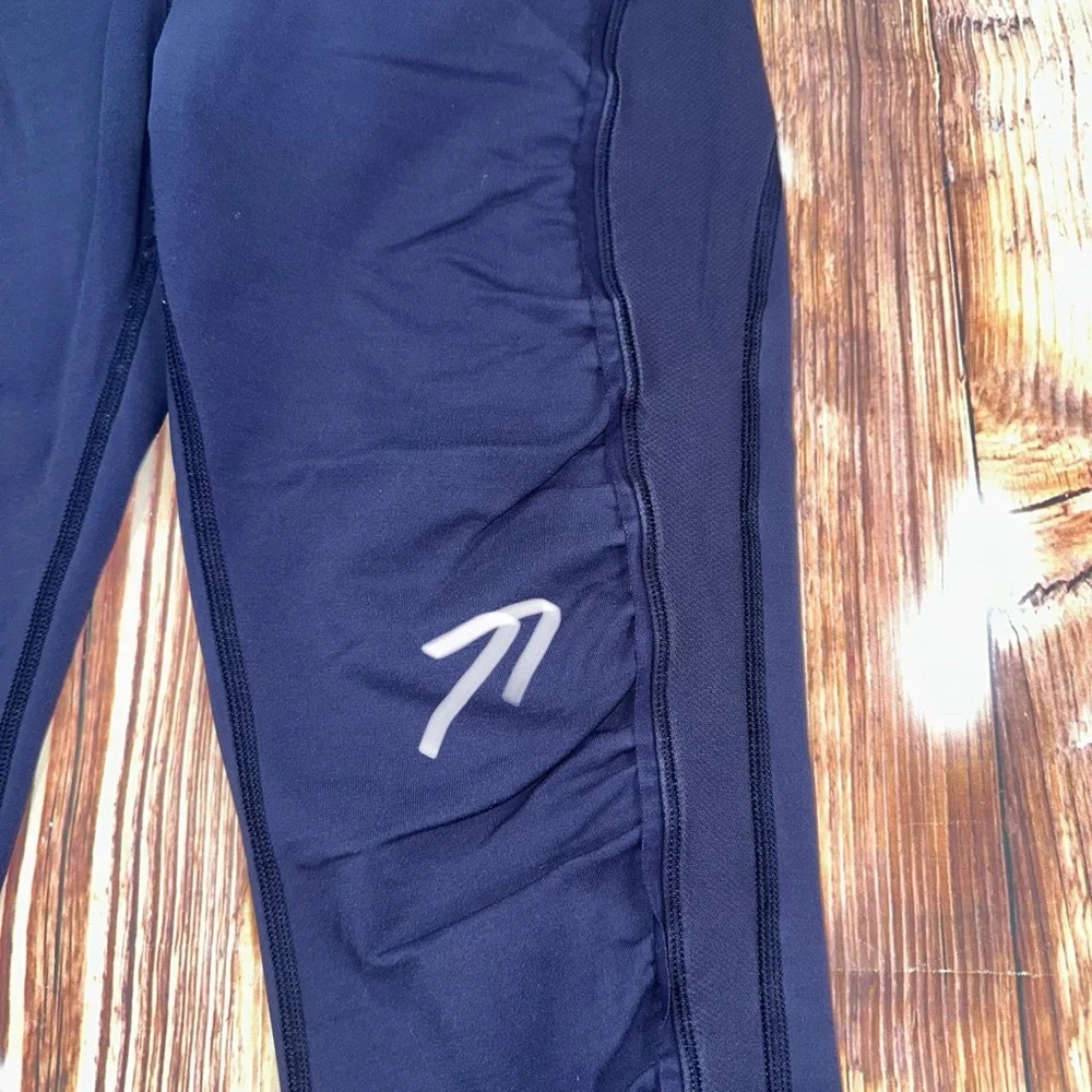Lululemon Dark Navy ,colorful waist ban and slightly cropped leggings Size 8.